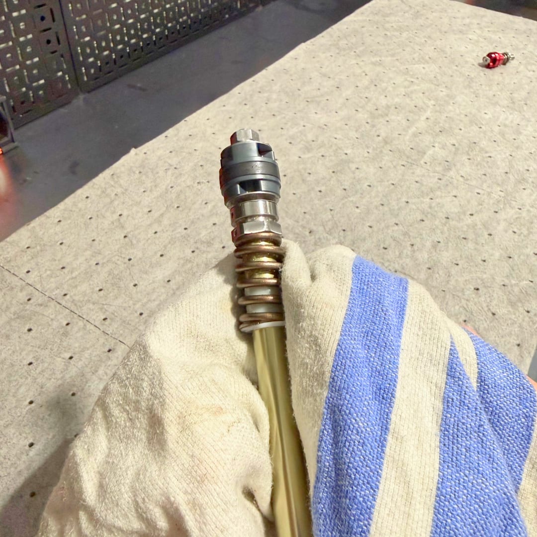 Rebound rod with the polished section wrapped in a clean cloth