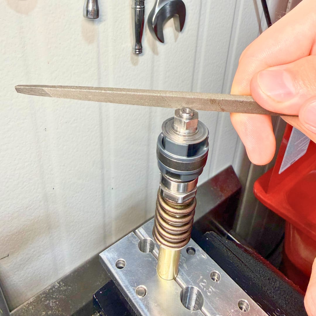 Unscrewing the nut from the restored threads