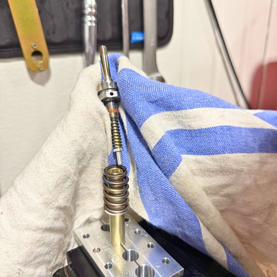 Unscrewing the old TAP from the rebound rod