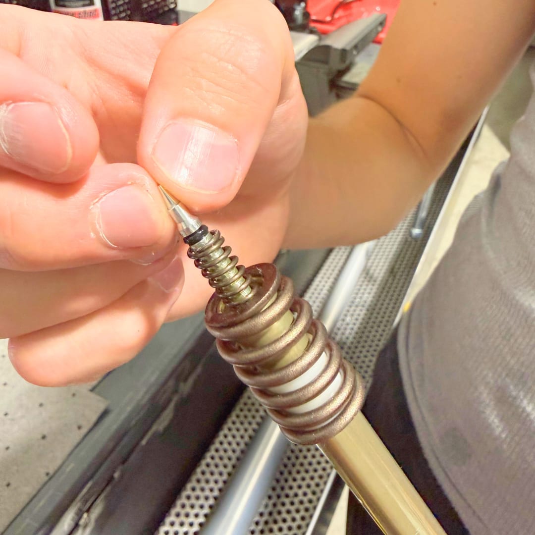 Top-out spring and rebound needle back on the rebound rod