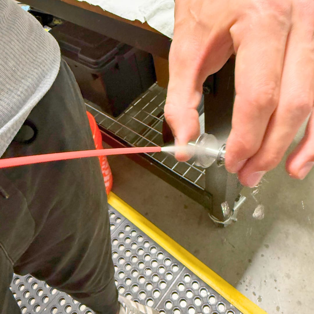 Spraying the assembled stack with contact cleaner