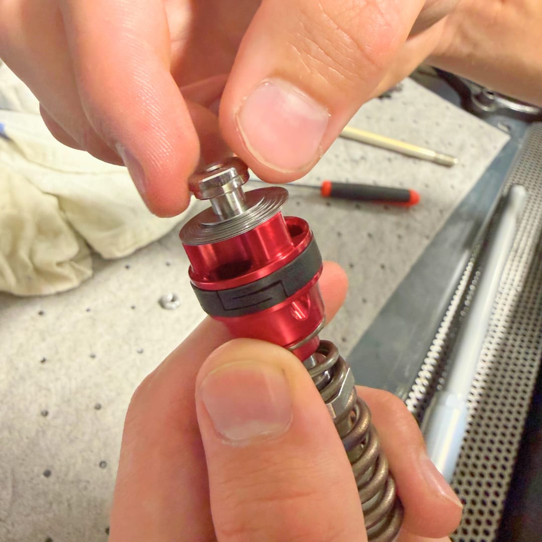 Hand tightening the stem through the stack into the TAP