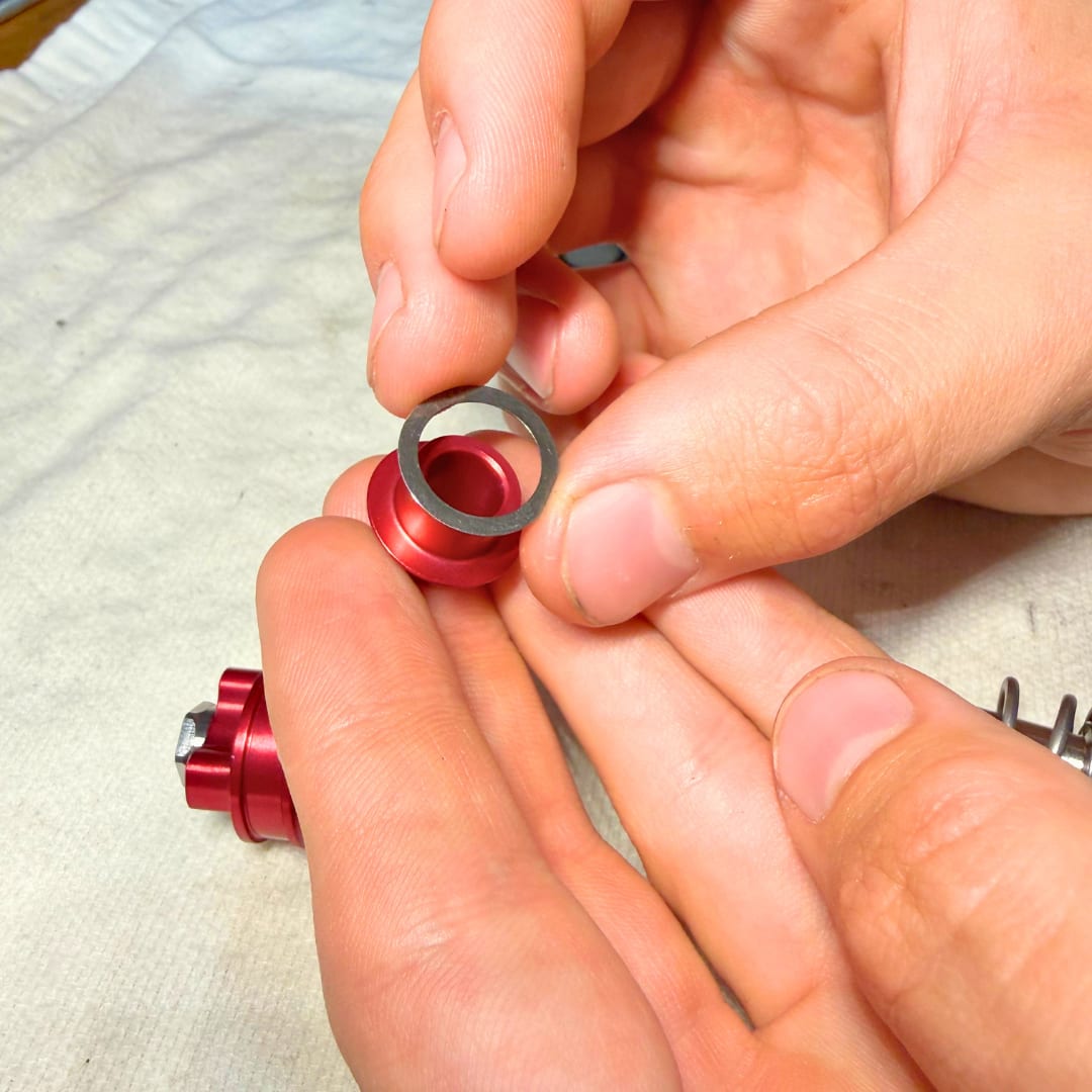 12 ID, 16 OD spacer shim held over the cone